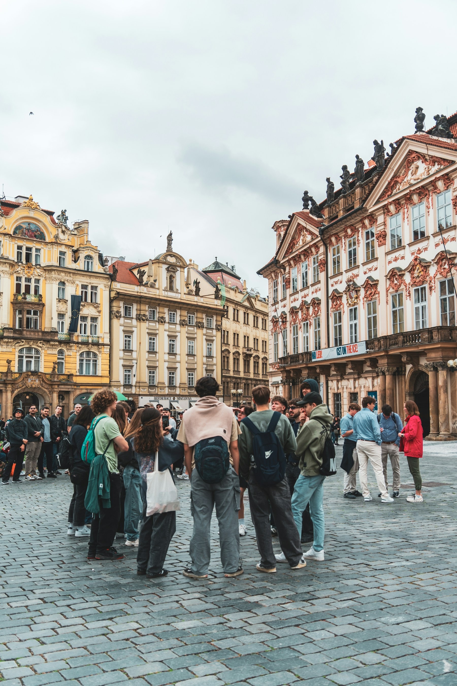 A walking tour group gathered in Prague's Old Town Square